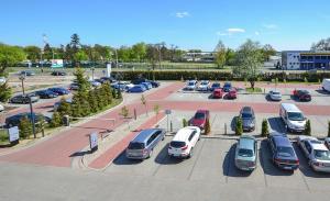 an aerial view of a parking lot with cars parked at Hotel IKAR in Bydgoszcz