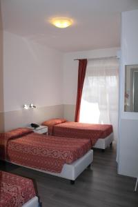 Postel nebo postele na pokoji v ubytování Alla Bianca Hotel