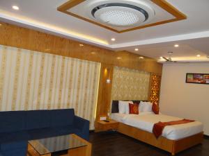 Ένα ή περισσότερα κρεβάτια σε δωμάτιο στο Hotel Tridev