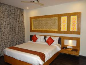 Ένα ή περισσότερα κρεβάτια σε δωμάτιο στο Hotel Tridev