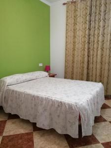 Cama o camas de una habitación en Pension Pinzapa