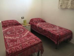 מיטה או מיטות בחדר ב-Appartamento Cavalieri