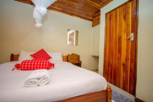 Ένα ή περισσότερα κρεβάτια σε δωμάτιο στο Sunshine Hotel Tengecha