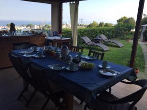 a table with a blue table cloth on it at B&B Il Tramonto in Anacapri