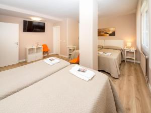 Cama o camas de una habitación en Gestión de Alojamientos Rooms