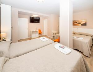 Un ou plusieurs lits dans un hébergement de l'établissement Gestión de Alojamientos Rooms