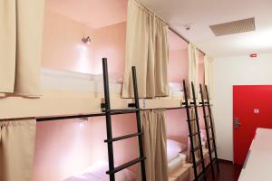 a group of bunk beds in a room at Maverick Budapest Soho in Budapest