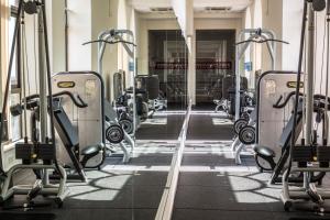 a gym with rows of tread machines at Corinthia St George's Bay in St. Julianʼs