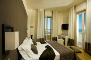 TV a/nebo společenská místnost v ubytování Hotel Miramare