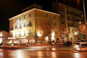 a building on the side of a street at night at Hotel Oriente in Teruel