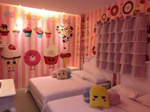 Postel nebo postele na pokoji v ubytování Fantasy Hotel