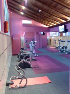 a gym with several exercise bikes in a room at Hotel Oriente in Teruel