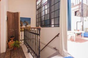 a room with a staircase with a window and a stair at La Boca B&B in Buenos Aires