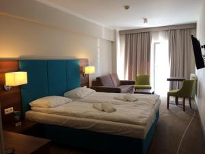 Posteľ alebo postele v izbe v ubytovaní Apartamenty Międzyzdroje