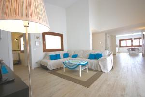 a living room with a couch and a table at Villa Franca by Wonderful Italy in San Teodoro