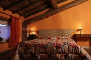 Postel nebo postele na pokoji v ubytování Relais Corte Sant' Agata B&B