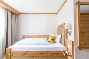 Postel nebo postele na pokoji v ubytování Hotel Gerbe