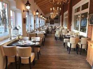 a row of tables and chairs in a restaurant at Leezdorfer Hof in Leezdorf
