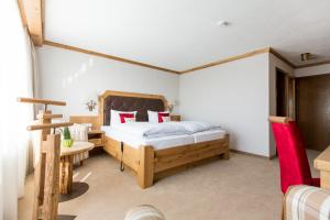Postel nebo postele na pokoji v ubytování Hotel Gerbe