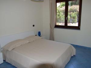 Postel nebo postele na pokoji v ubytování Residence Tre Palme