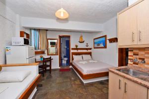 Posteľ alebo postele v izbe v ubytovaní Haus Niko Apartments and Suites