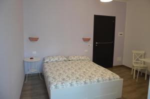 Postel nebo postele na pokoji v ubytování B&B Maison Blanche