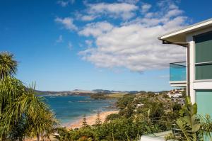 a view of the beach from a house at Doubtless Bay Villas in Cable Bay