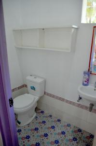 a bathroom with a toilet and a sink at Sablayan Paraiso Beach Resort in Sablayan