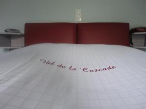 Voodi või voodid majutusasutuse Hotel Val De La Cascade toas
