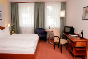 Ένα ή περισσότερα κρεβάτια σε δωμάτιο στο Hotel Florianerhof
