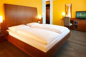 Letto o letti in una camera di Montfort - das Hotel