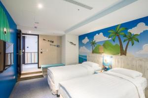 a bedroom with three beds and a palm tree mural at RF Hotel - Sanchong in Taipei