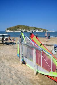 a group of windsurfing equipment on a beach at Hotel Portonuovo in Vieste