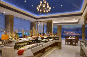 a buffet in a hotel lobby with a table of food at Fortune Landmark, Ahmedabad - Member ITC's Hotel Group in Ahmedabad