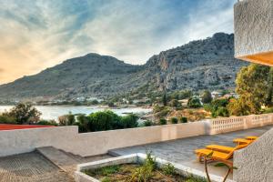 a house with a view of a mountain at Anthi Maria Beach Apartments in Pefki Rhodes