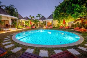 a swimming pool in the yard of a house at Secret Garden Beach Resort in Bangrak Beach