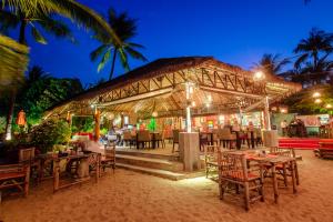 a restaurant on the beach at night at Secret Garden Beach Resort in Bangrak Beach