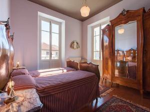 Un pat sau paturi într-o cameră la La Séca - Antico Albergo Alzese