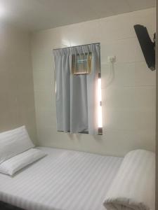 Postelja oz. postelje v sobi nastanitve Unique Hostel