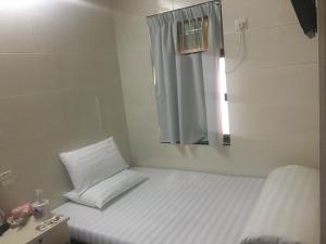 Postelja oz. postelje v sobi nastanitve Unique Hostel