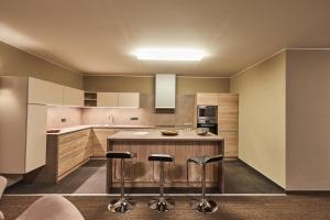 Kuchyňa alebo kuchynka v ubytovaní Apartmány Volarik