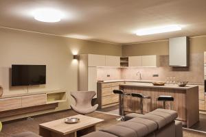 Kuchyňa alebo kuchynka v ubytovaní Apartmány Volarik
