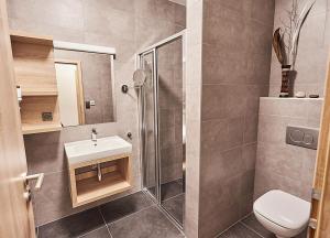 Kúpeľňa v ubytovaní Apartmány Volarik + 16 fotografií