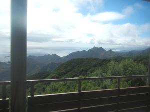 a view of the mountains from a balcony at Albergue Montes de Anaga in El Bailadero