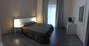 Postel nebo postele na pokoji v ubytování Ibasilischi + 8 fotografií