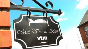 a sign for a mill when in bednin at B&B De Noorderwind in Schoonaarde