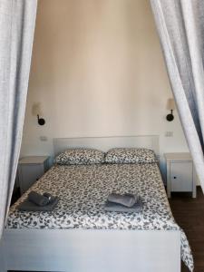 Postelja oz. postelje v sobi nastanitve B&B Sant'Agostino