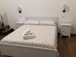 Łóżko lub łóżka w pokoju w obiekcie B&B Sant'Agostino