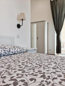 Łóżko lub łóżka w pokoju w obiekcie B&B Sant'Agostino