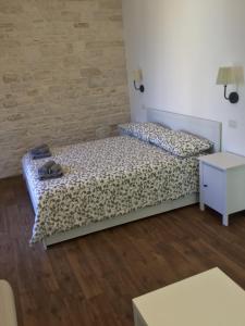 Łóżko lub łóżka w pokoju w obiekcie B&B Sant'Agostino